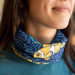 Close up photo of a neck gaiter featuring a clownfish.